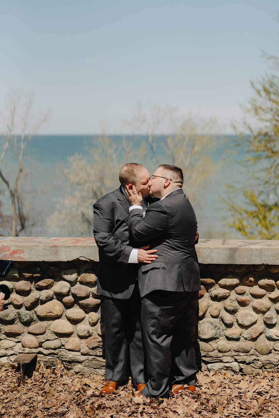 Gay couple kissing at wedding in Rochester NY