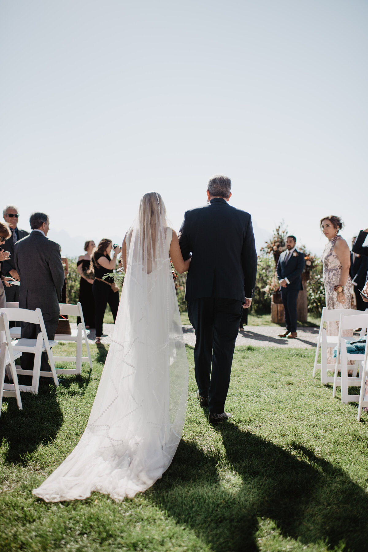 Photographers Jackson Hole capture bride being walked down aisle with father