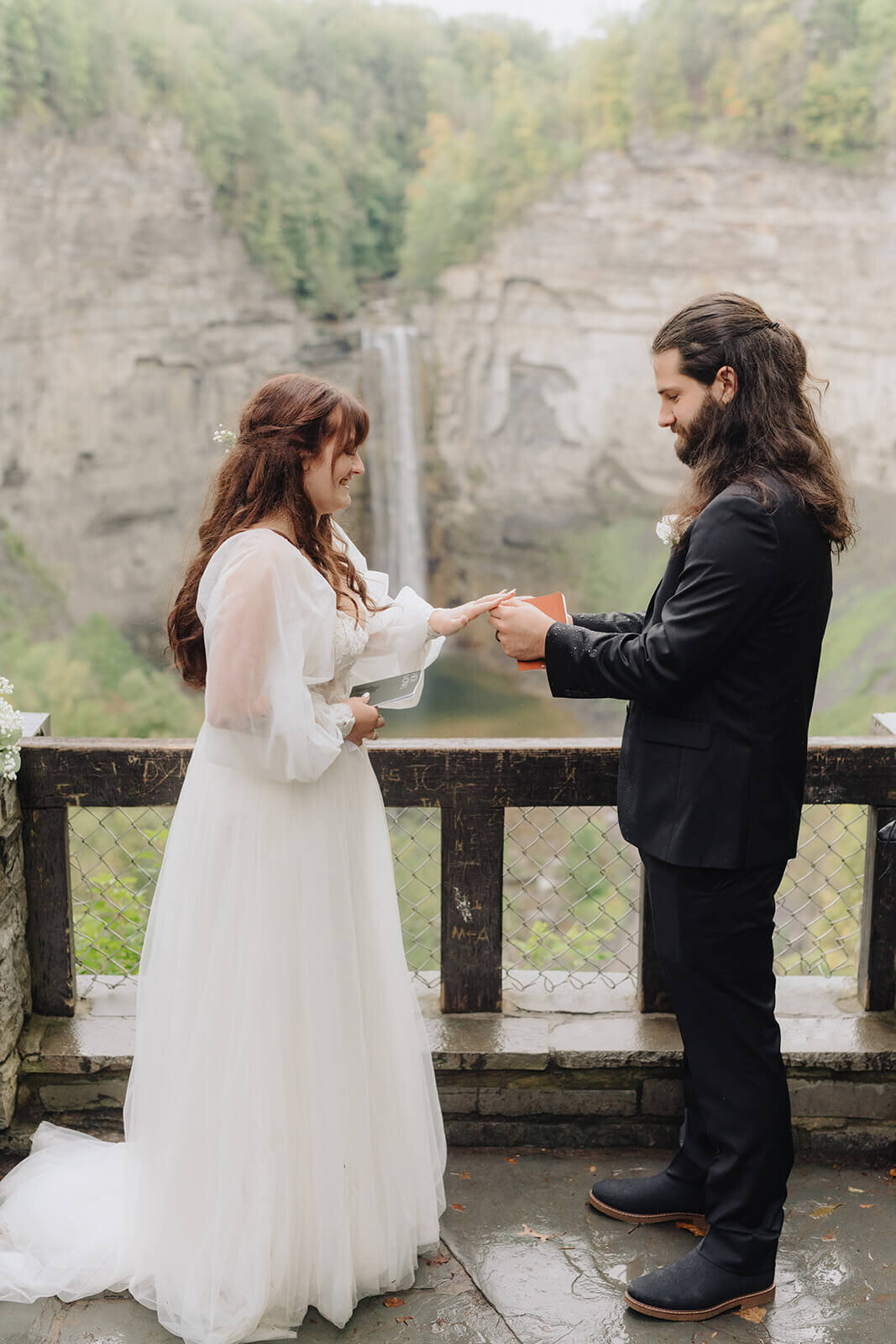 Bride and groom exchanging vows in front of a waterfall, Finger Lakes wedding, NY