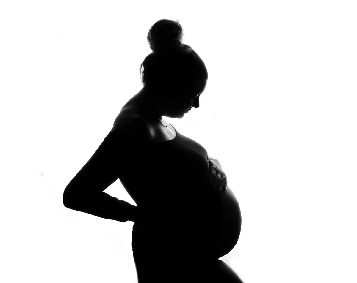 a silhouette of a pregnant woman