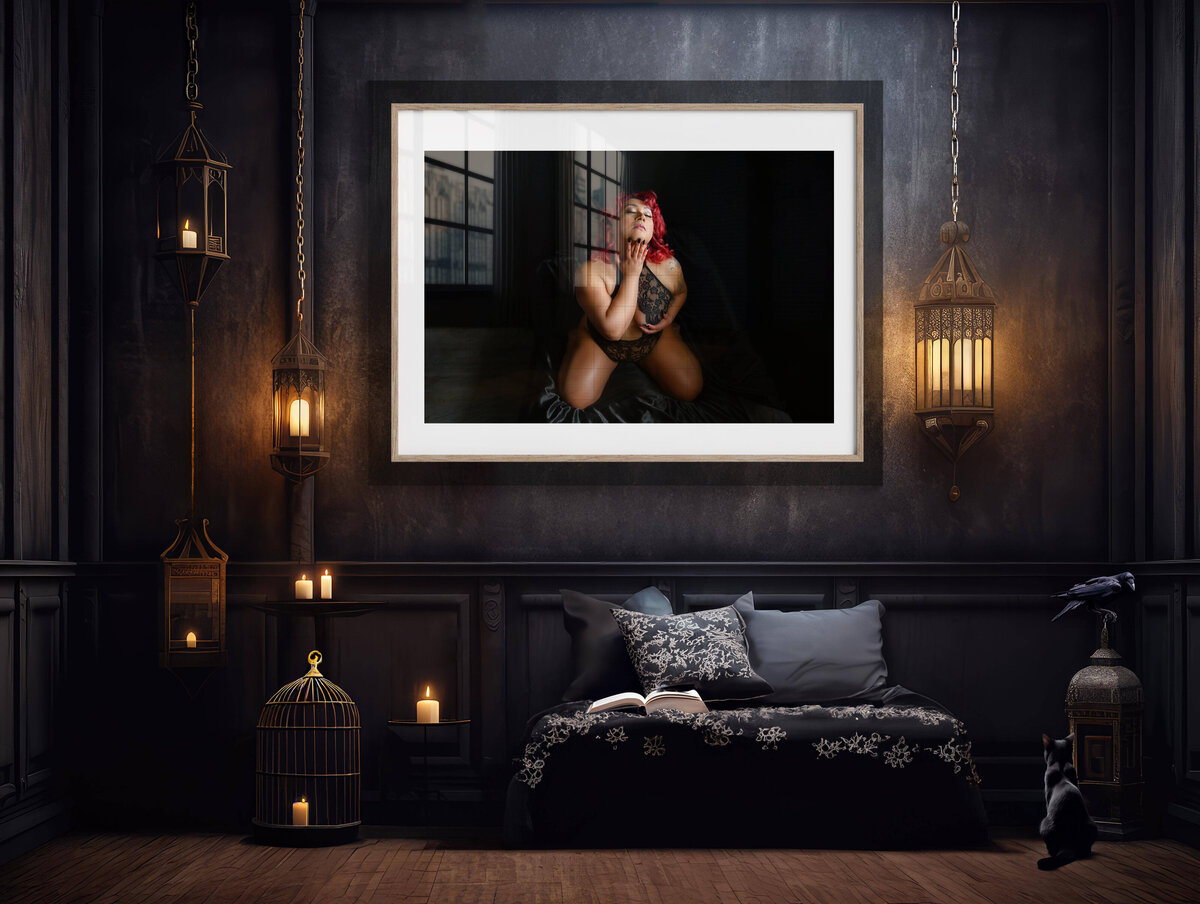 Dark grey room with a woman with red hair in a frame over the bed.