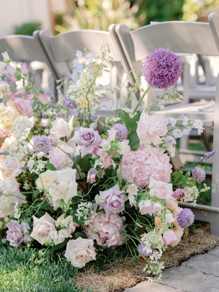garden arrangement, beginning of aisle arrangements , pastel flowers, lavender