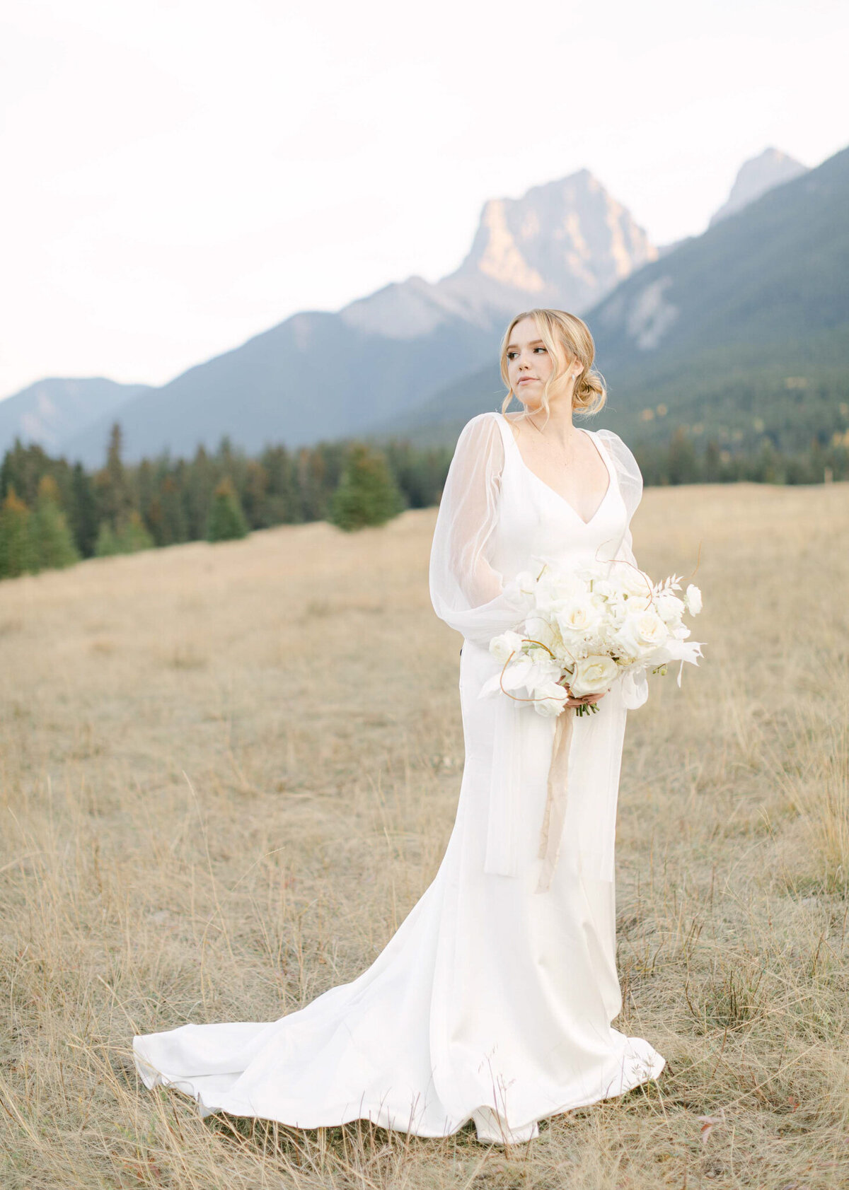 Stunning bridal portrait in the mountains by Megan Renee Photography, classic and romantic wedding photographer in Calgary, Alberta. Featured on the Bronte Bride Vendor Guide.