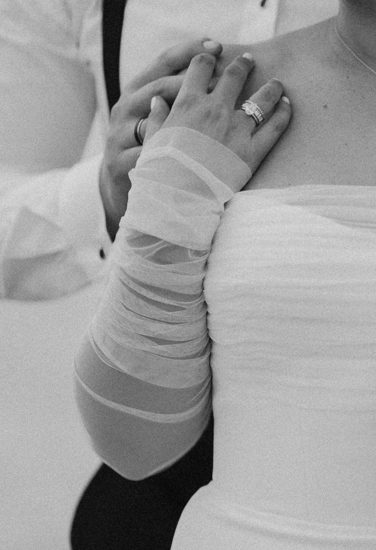 Close-up of bride and groom holding hands, showcasing wedding rings, captured by Claudia Amalia, a wedding and lifestyle photographer based in Miami and Florida Keys, South Florida. Destination weddings available. Portfolio highlight.