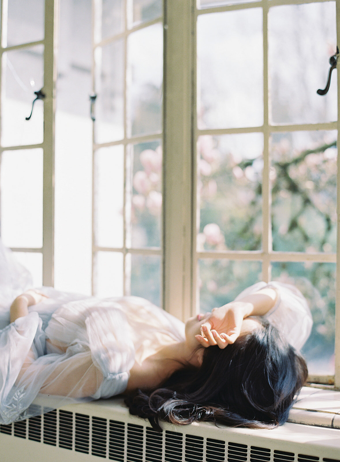 bride relaxing with hand on face