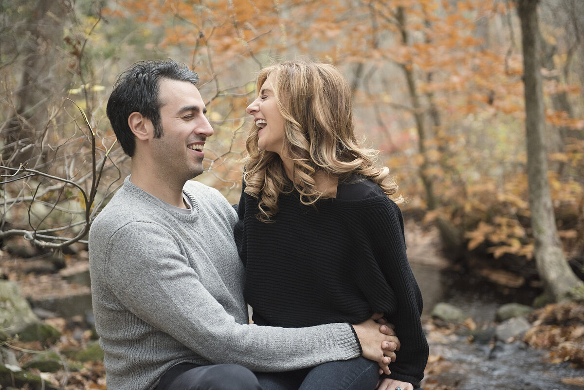 A couple sitting together laughing
