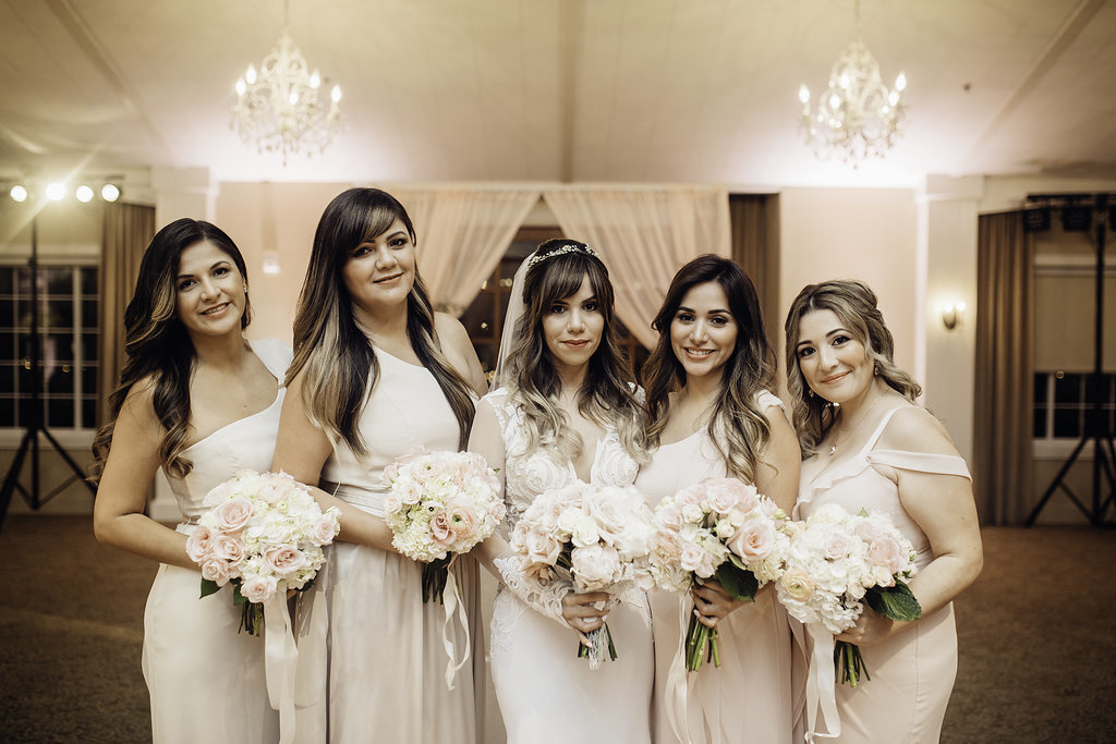 Wedding Photograph Of Bride And Bridesmaid Carrying Bouquet Los Angeles