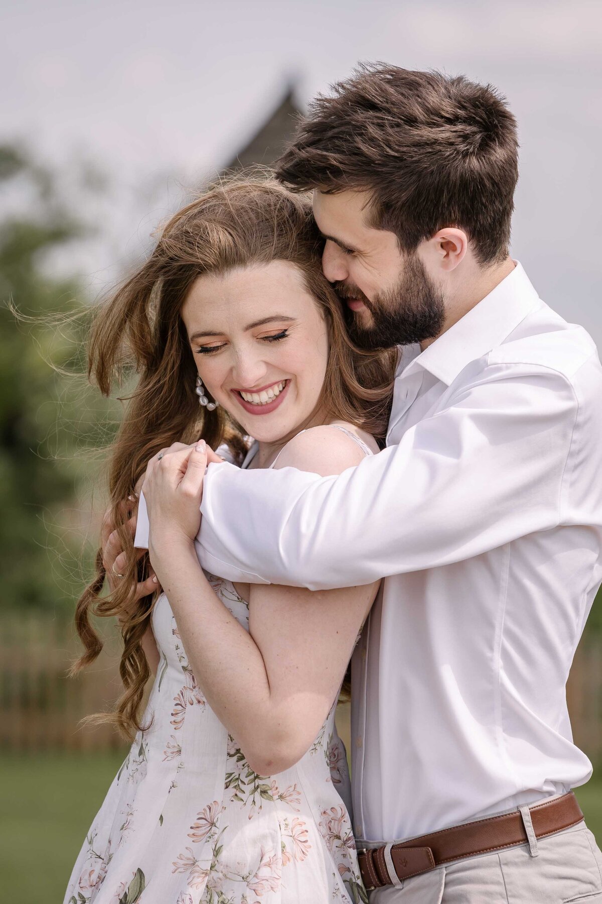 A man whispering in a woman's ear