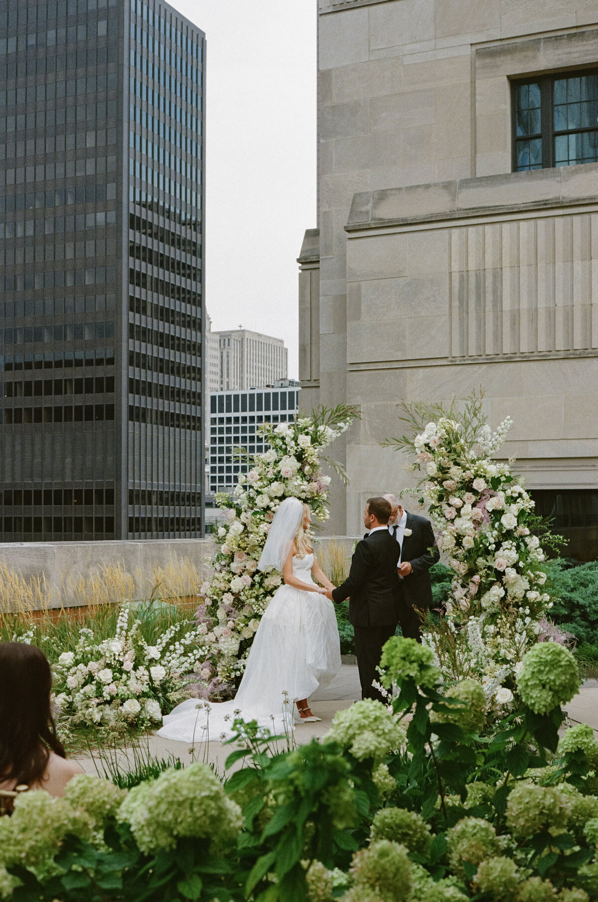 Fashion forward editorial wedding photography captures ceremony elegance at Old Post Office Chicago, showcasing Lauren Alatriste's sophisticated approach combining architectural grandeur with magazine-worthy imagery and authentic wedding emotion.