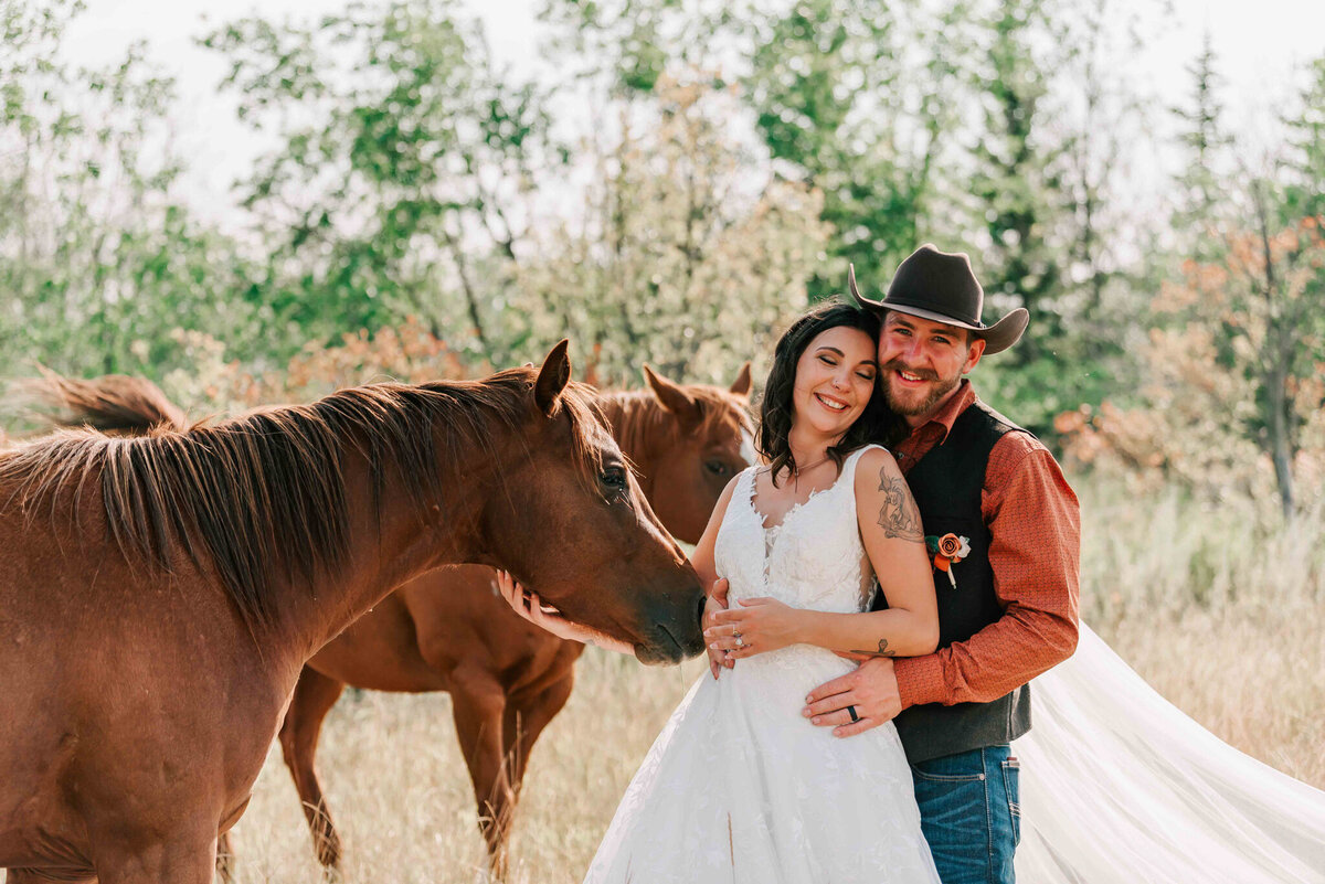 groom stand behind bride and the horses come to her. 