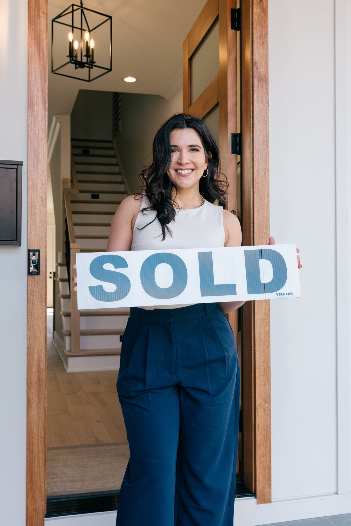 realtor-holding-sale-sign
