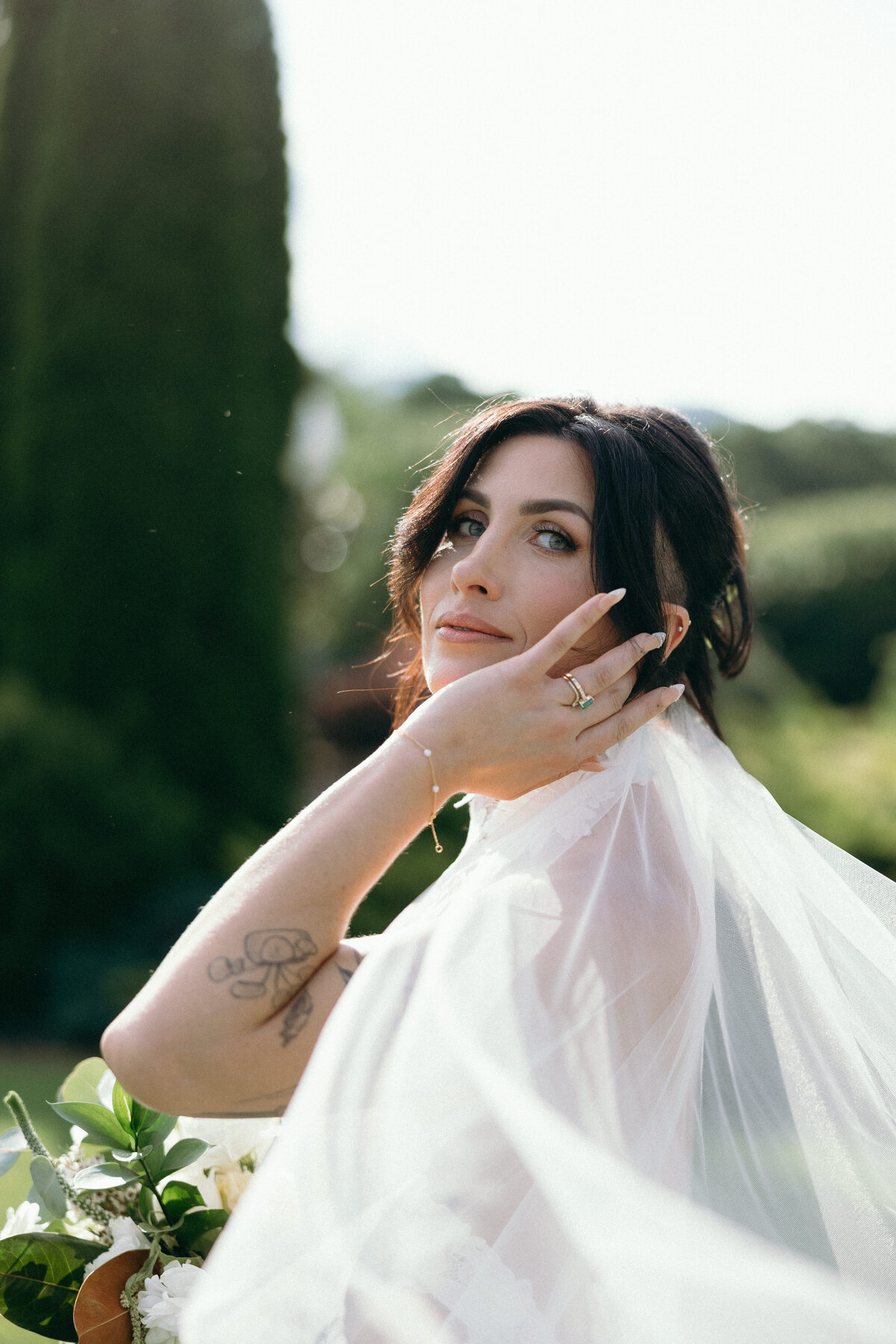 Bride’s veil flowing softly in the breeze.