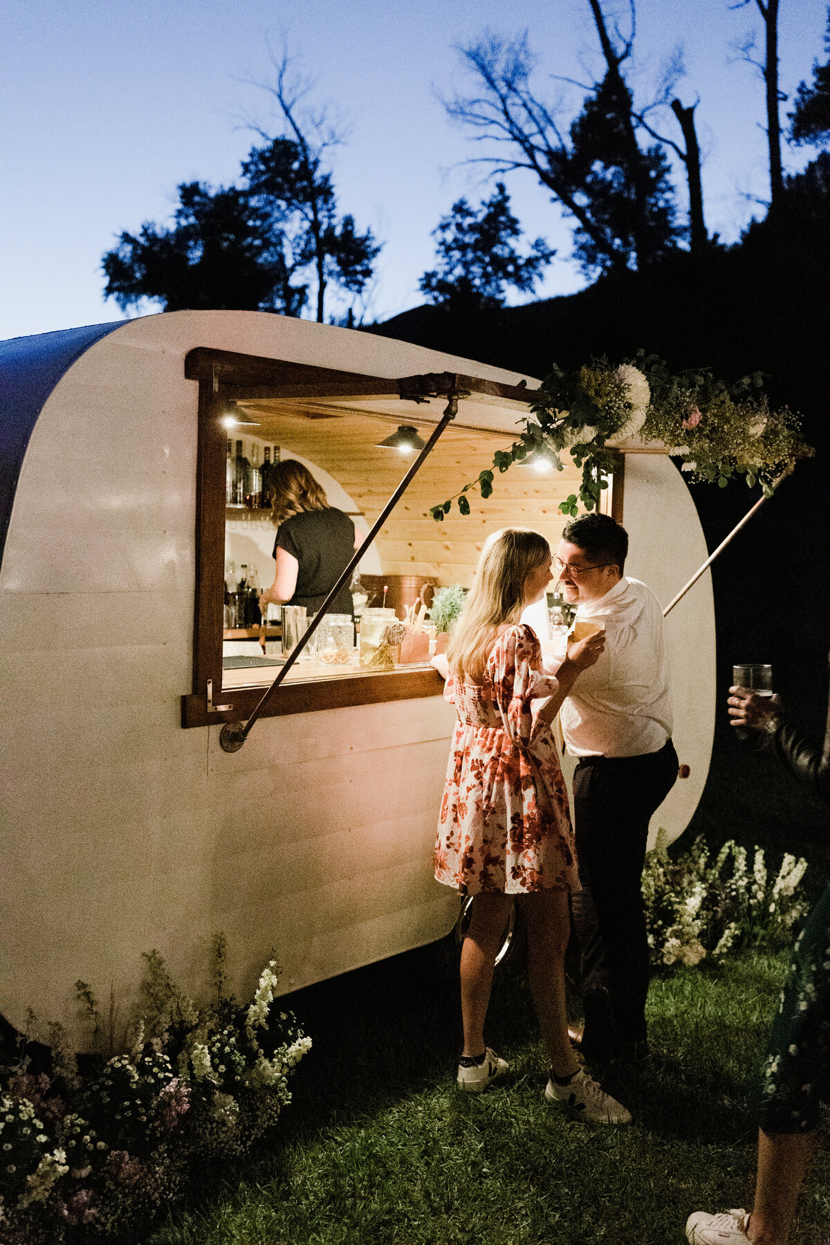 Guests ordering drinks from mobile cocktail bar at Dallenbach Ranch Wedding