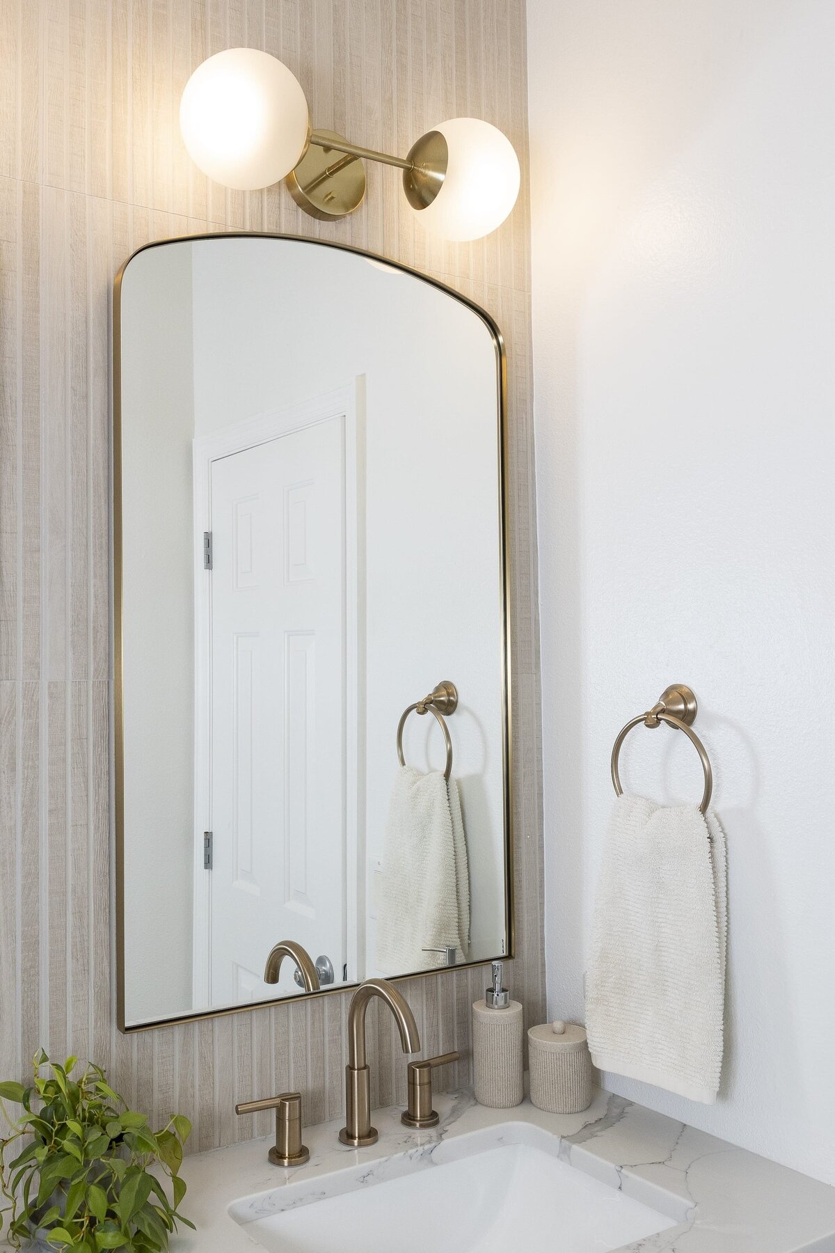 dewine design orlando interior designer contemporary coastal teen bathroom golden mirror with bronze sink faucet