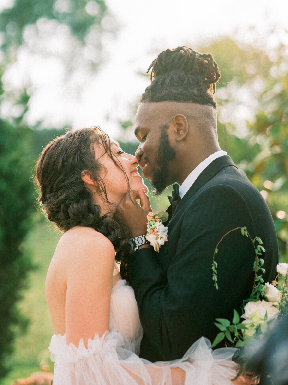 Bride and Groom share a sweet moment in the vineyard at sunset.