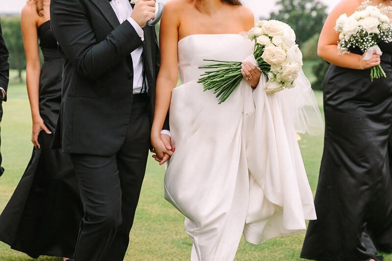 bride-and-groom-rainy-umbrella-evansville-country-club17