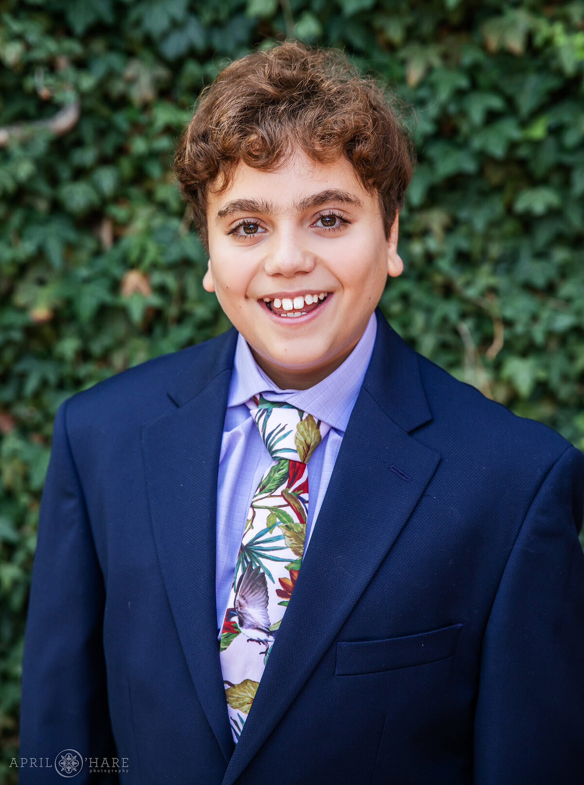 Young Man wearing a Tropical Tie with his Blue Suit on the Day of his Bar Mitzvah in Denver Colorado