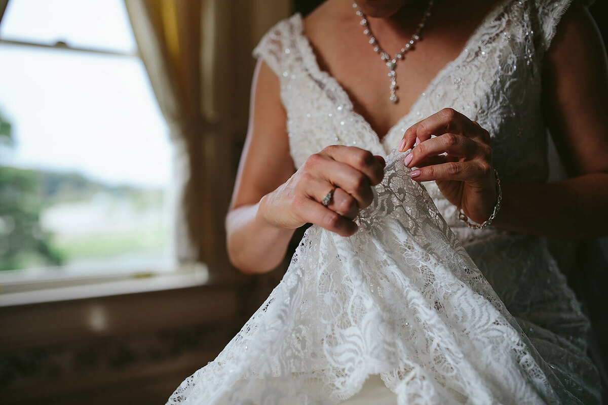 Bride-Fixing-Wedding-Dress-Apopka-Historical-Home