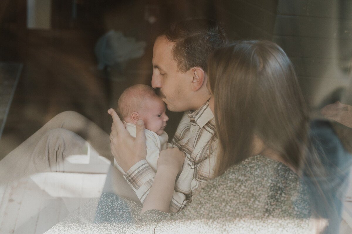 Family in living room with their baby.