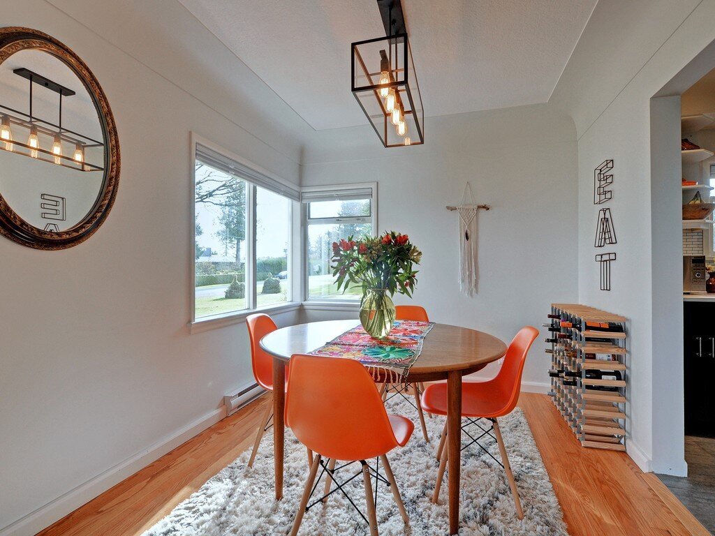 Midcentury modern dining room design with pendant lighting, oak dining table and shag rug by Hanbury Design Co.