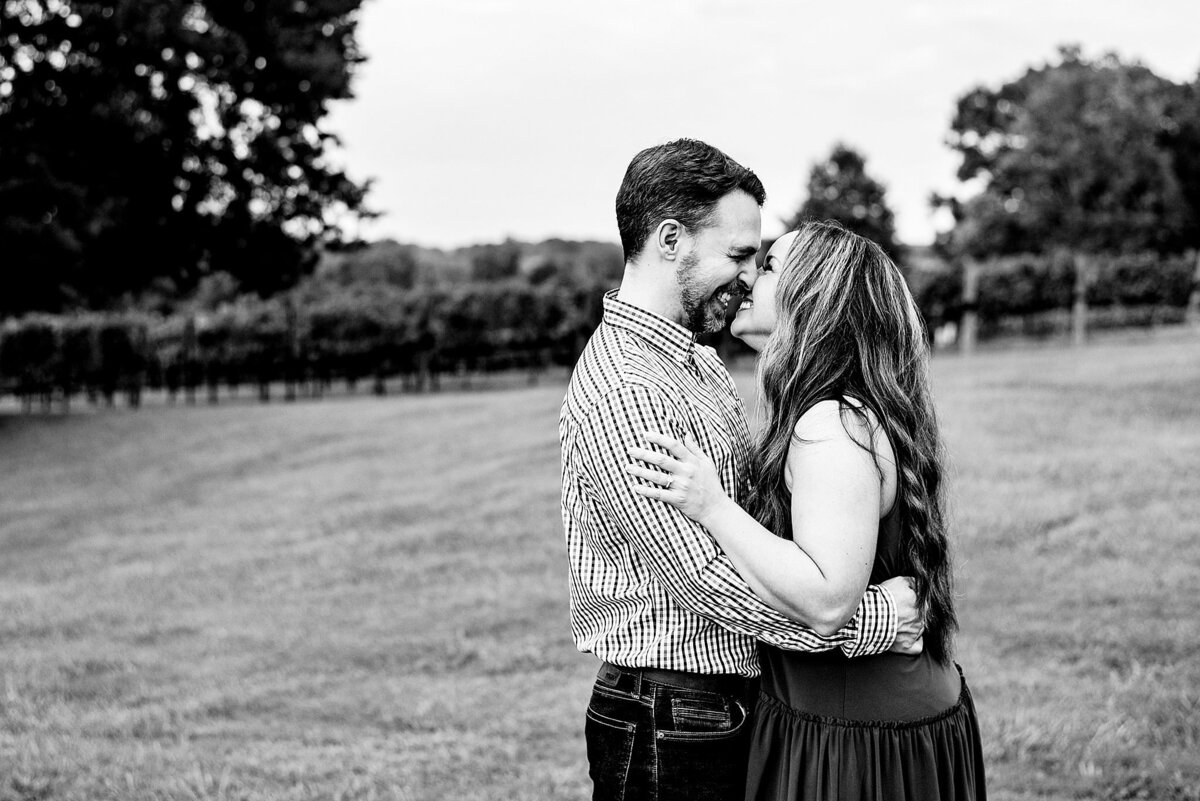 Black and White photo of couple at Arrington Vineyards snuggled nose to nose