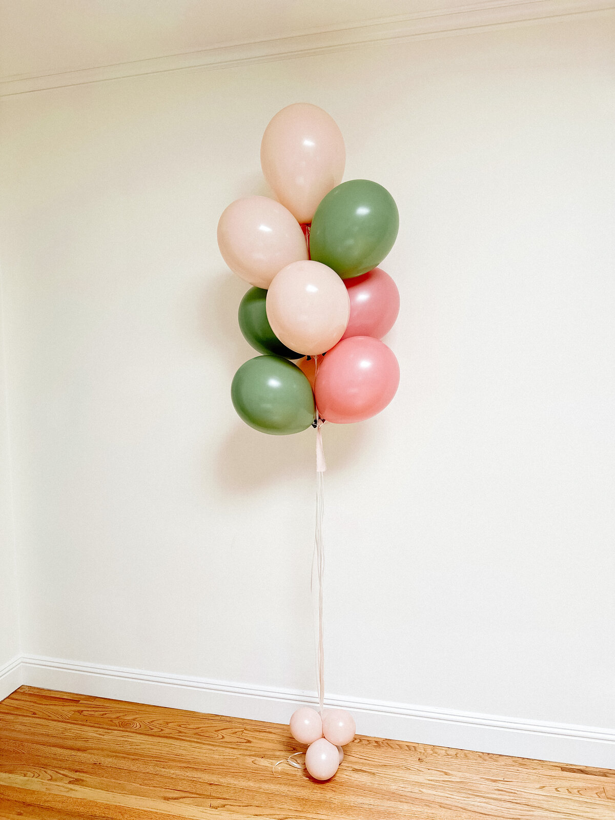 Pink and green weighted helium balloon decor