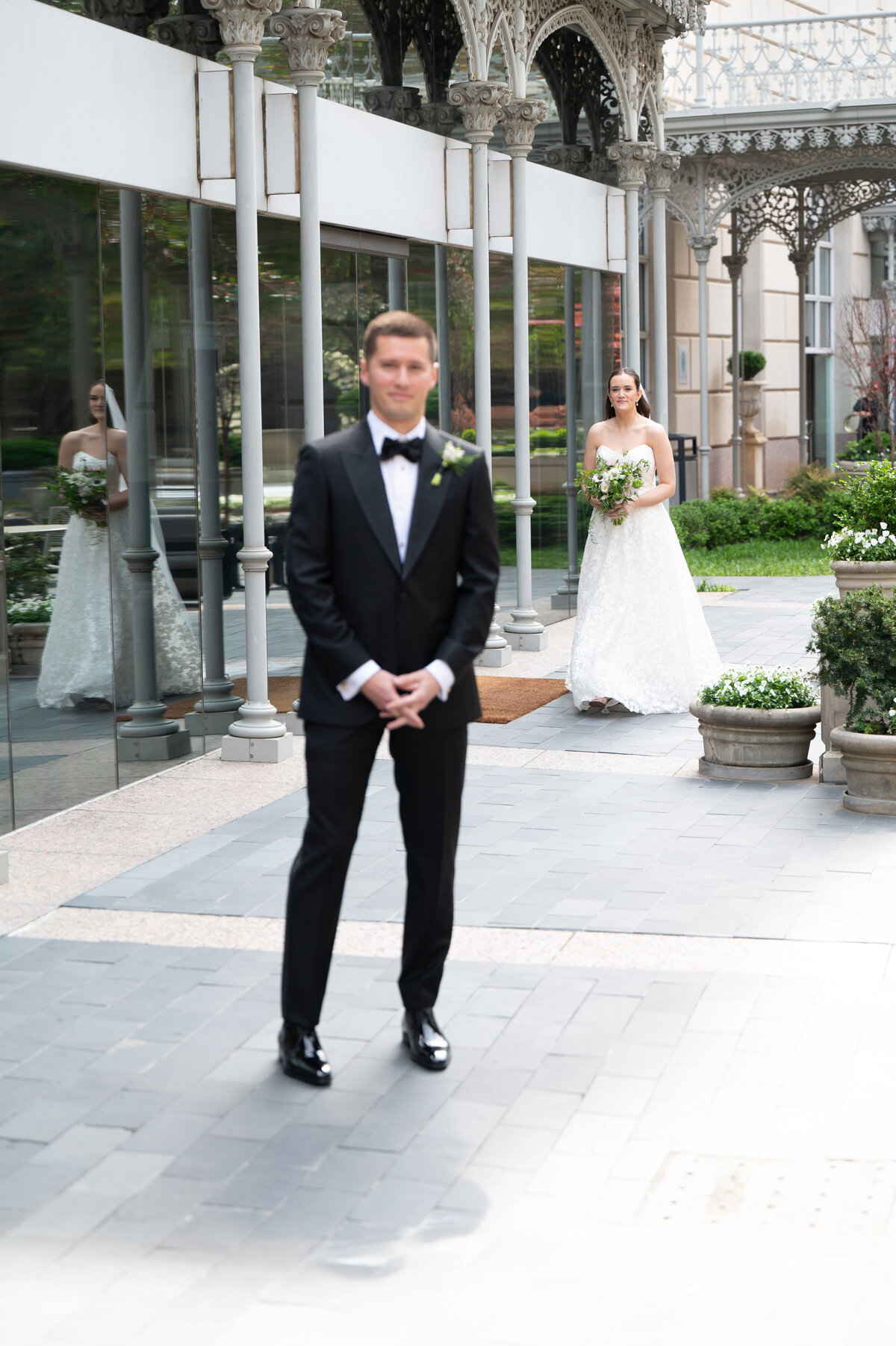 Bride walking to her groom for a first look in downtown Dallas