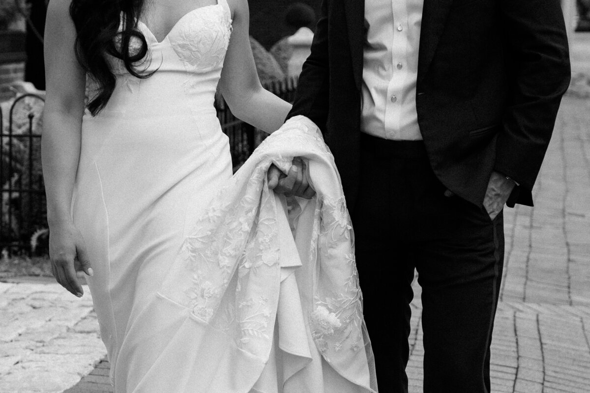 bride and groom holding hands at reception