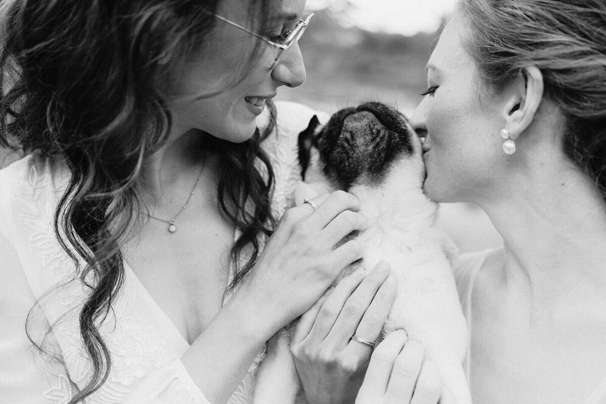 Brides with pug dog at Cornell University wedding