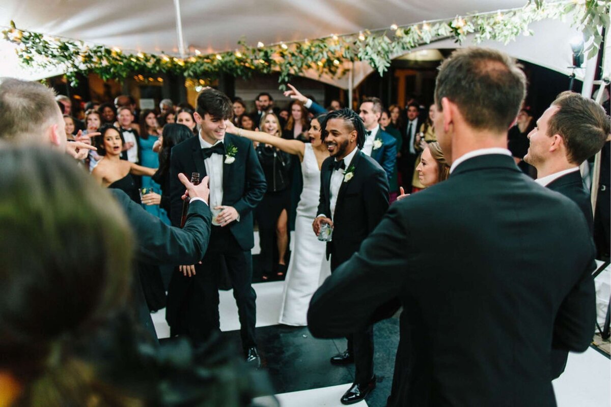 Dancing under the Tent at a Luxury Michigan Lakefront Golf Club Wedding.