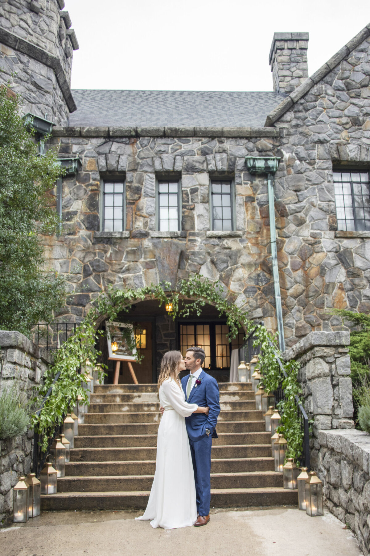 Couple kissing during wedding photos at Homewood Asheville