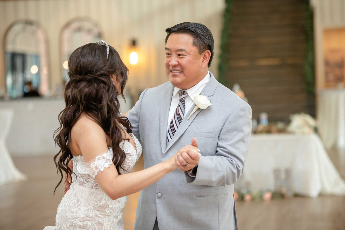 bride dances with asian father at Milestone New Braunfels  wedding