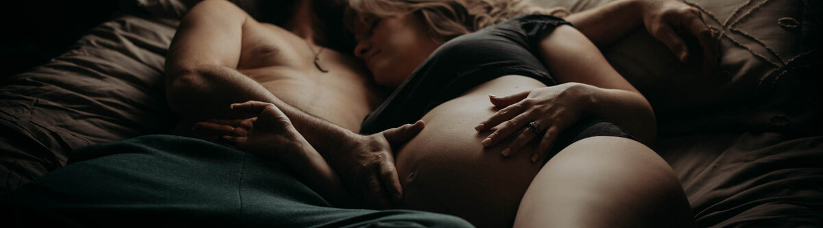 Maternity Photographer, man holding woman's pregnant belly