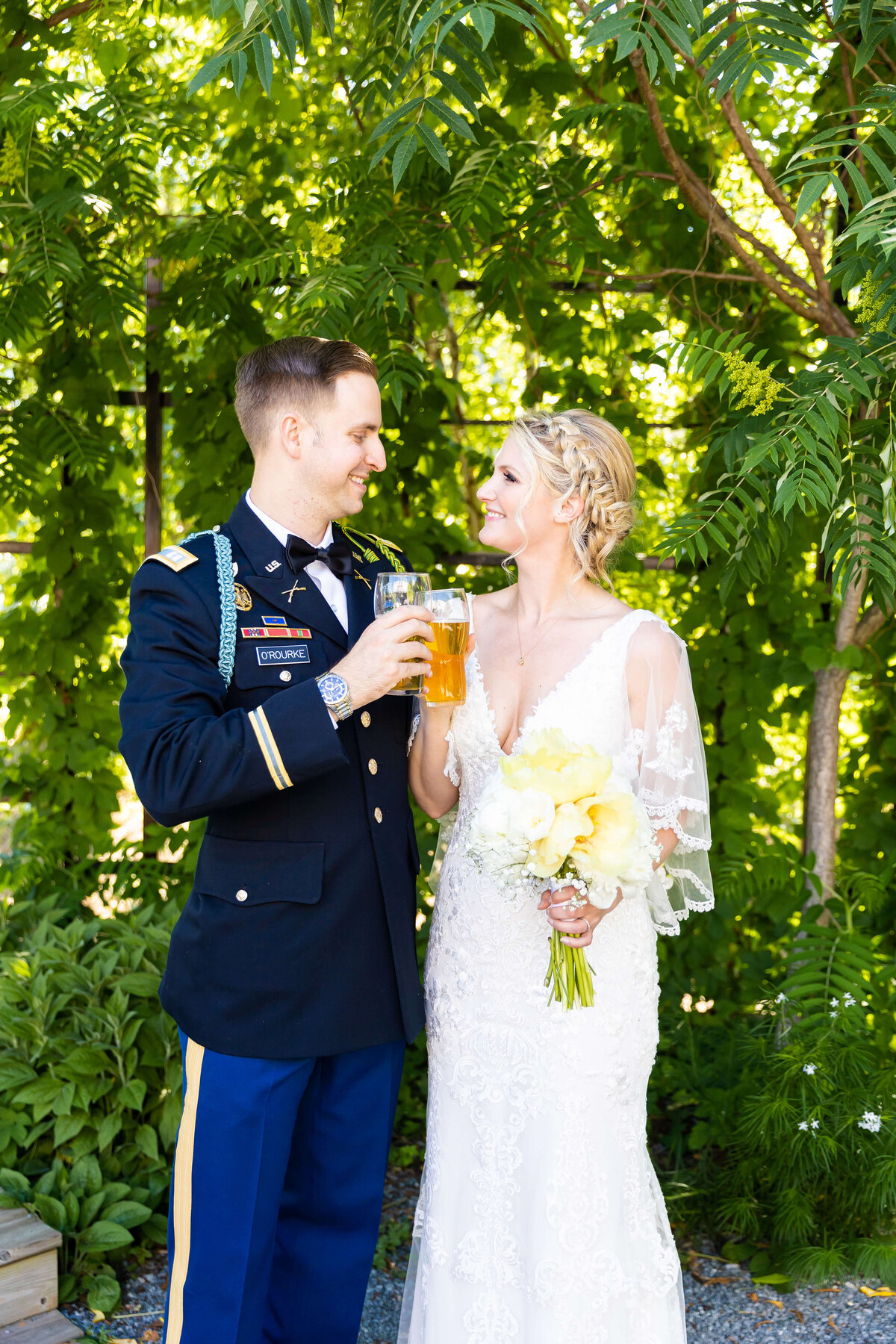 Bride and groom toasting glasses at Fat Bottom Brewery wedding in Nashville, TN