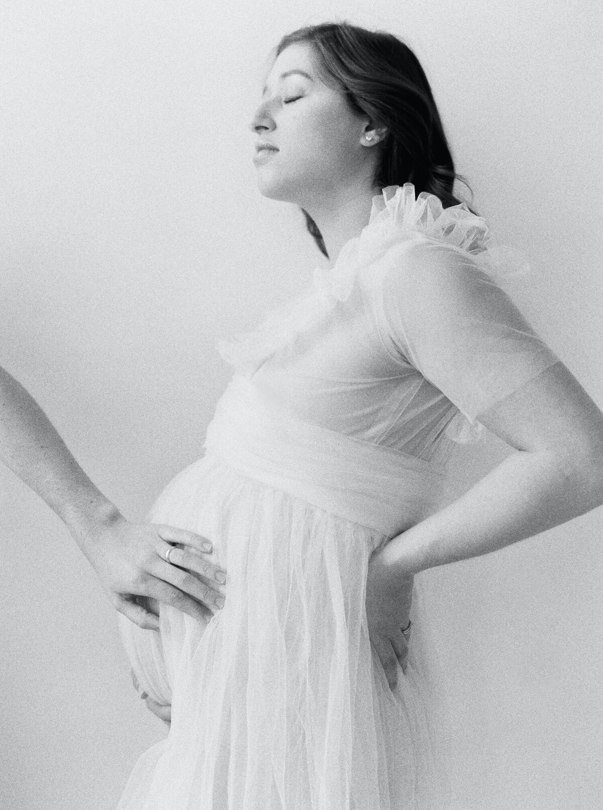black and white film photos of expecting mother shot in studio by Seattle Maternity Photographer