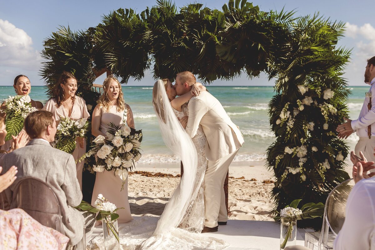 Bride and Grooms first kiss at wedding in Riviera Maya