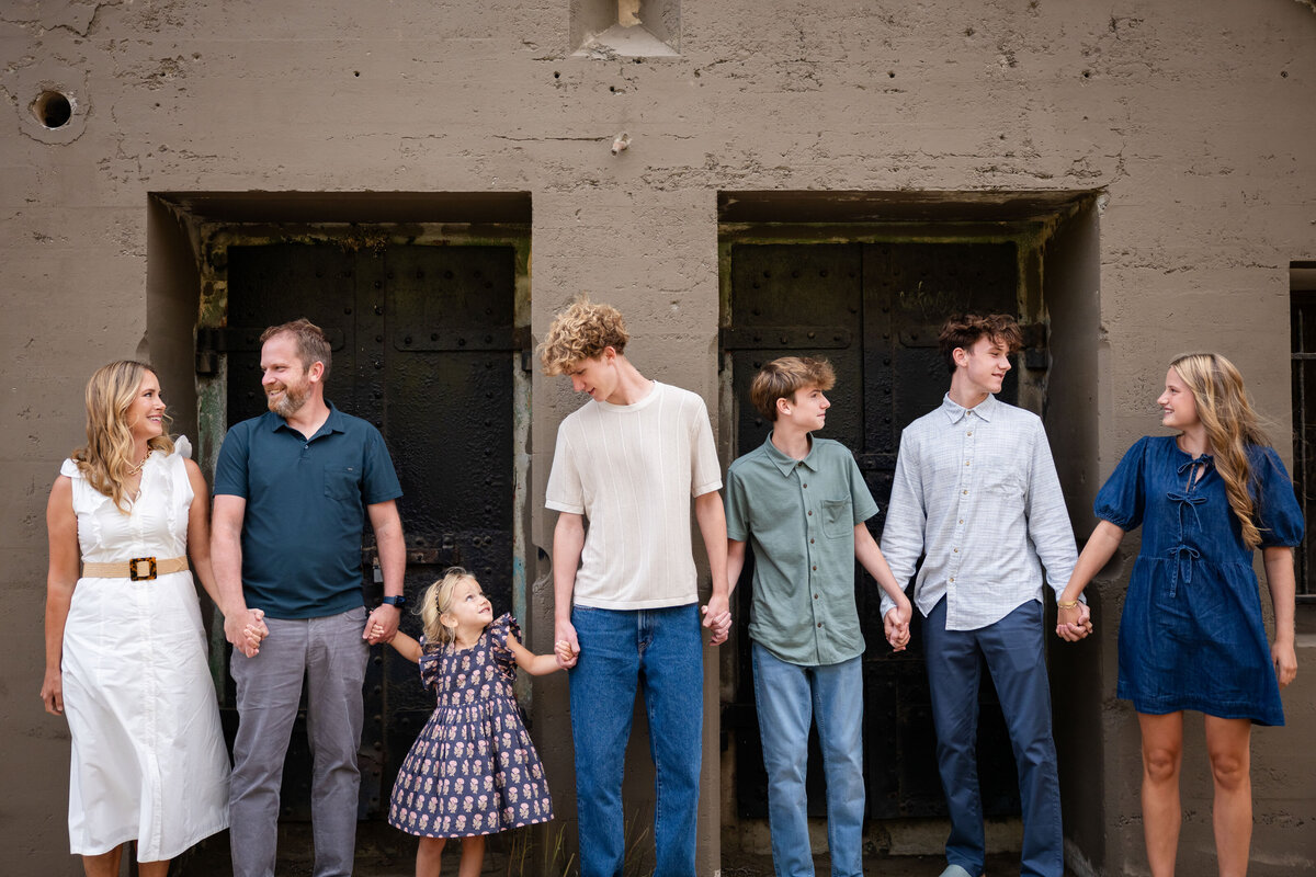 Family with 5 kids holding hands in San Francisco Bunker