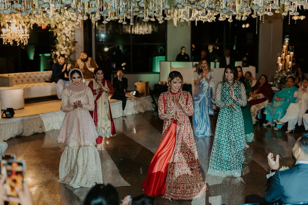 Bridesmaids dance during the reception of a wedding at the Bowery House and Gardens.