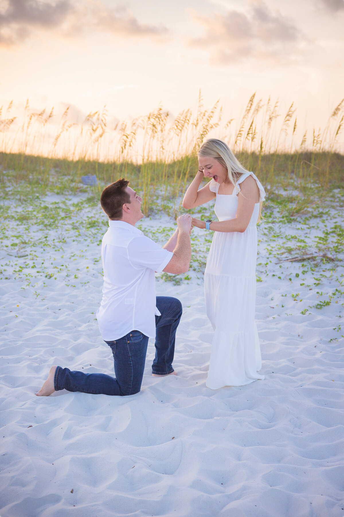 man putting ring on fiancee during proposal