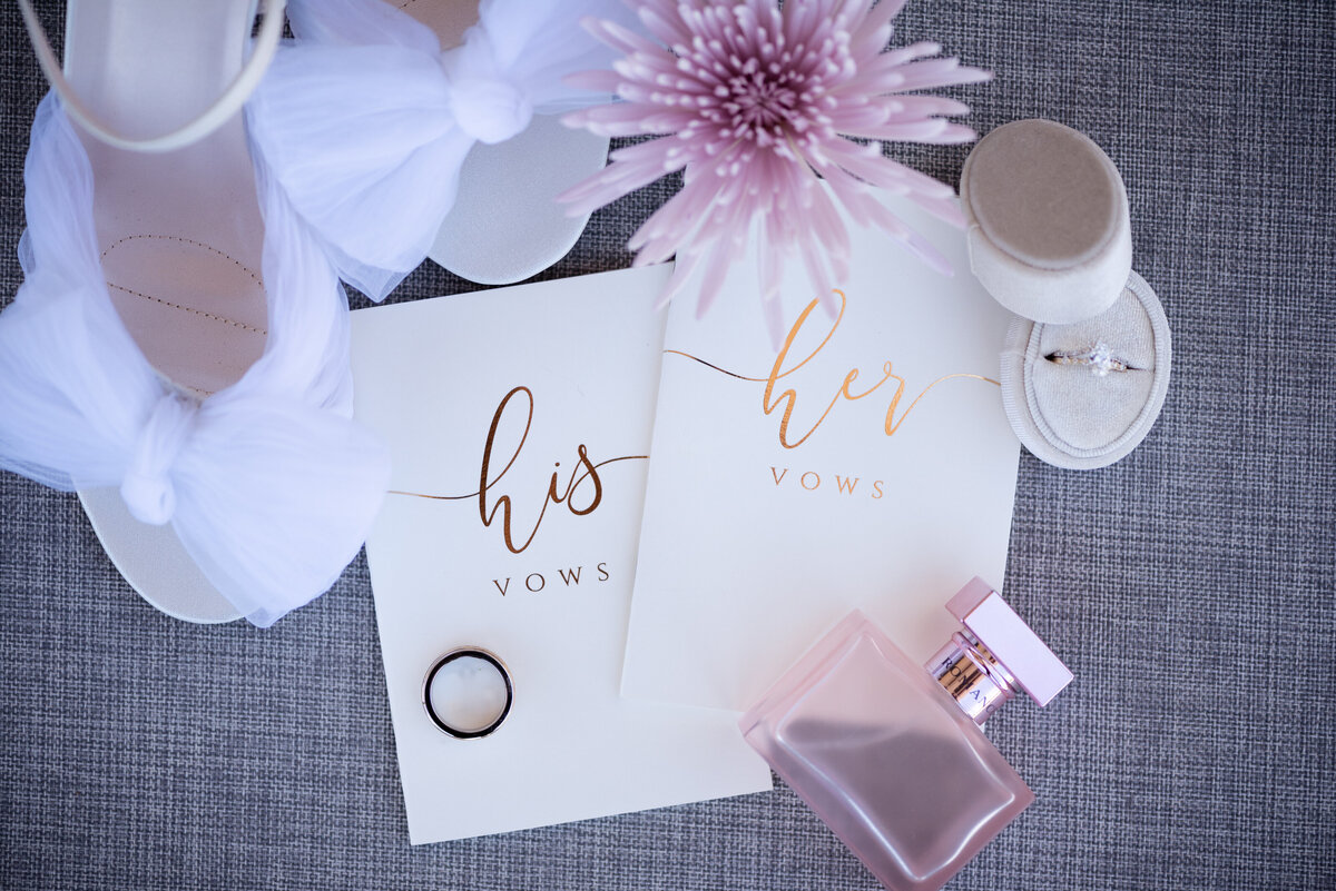 his and her vows flatlay details wedding photos