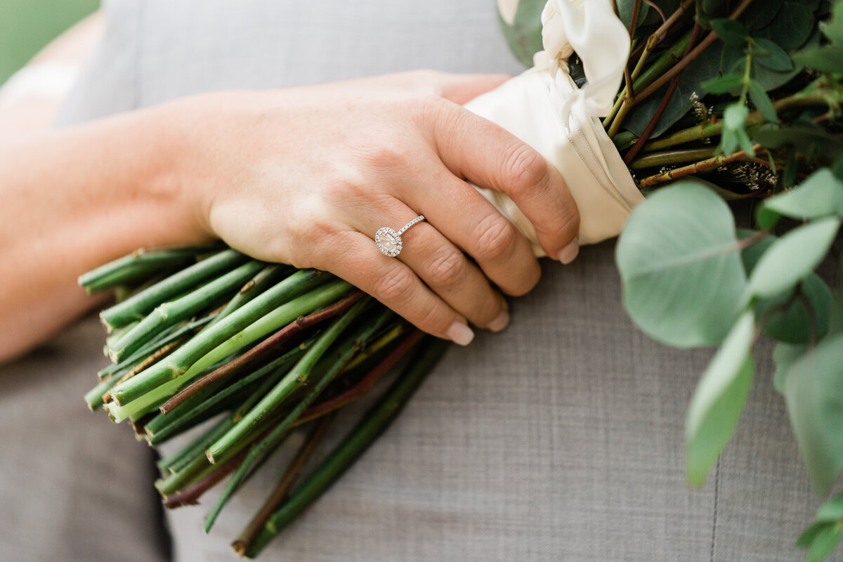 Bride's hand holding bouquet