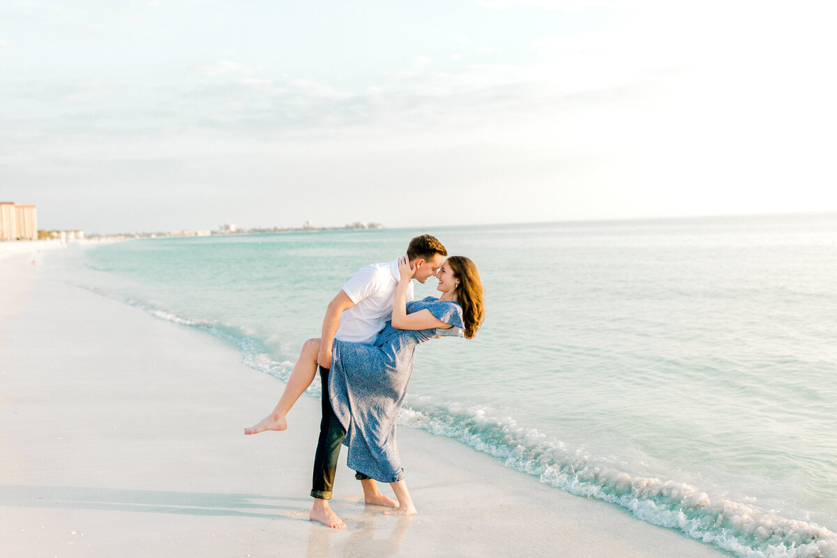 engaged couple for photos at lido key beach in florida