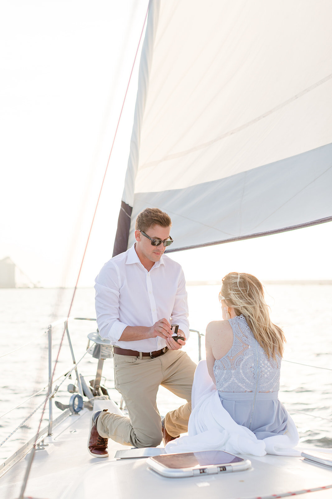 Man proposing on sailboat