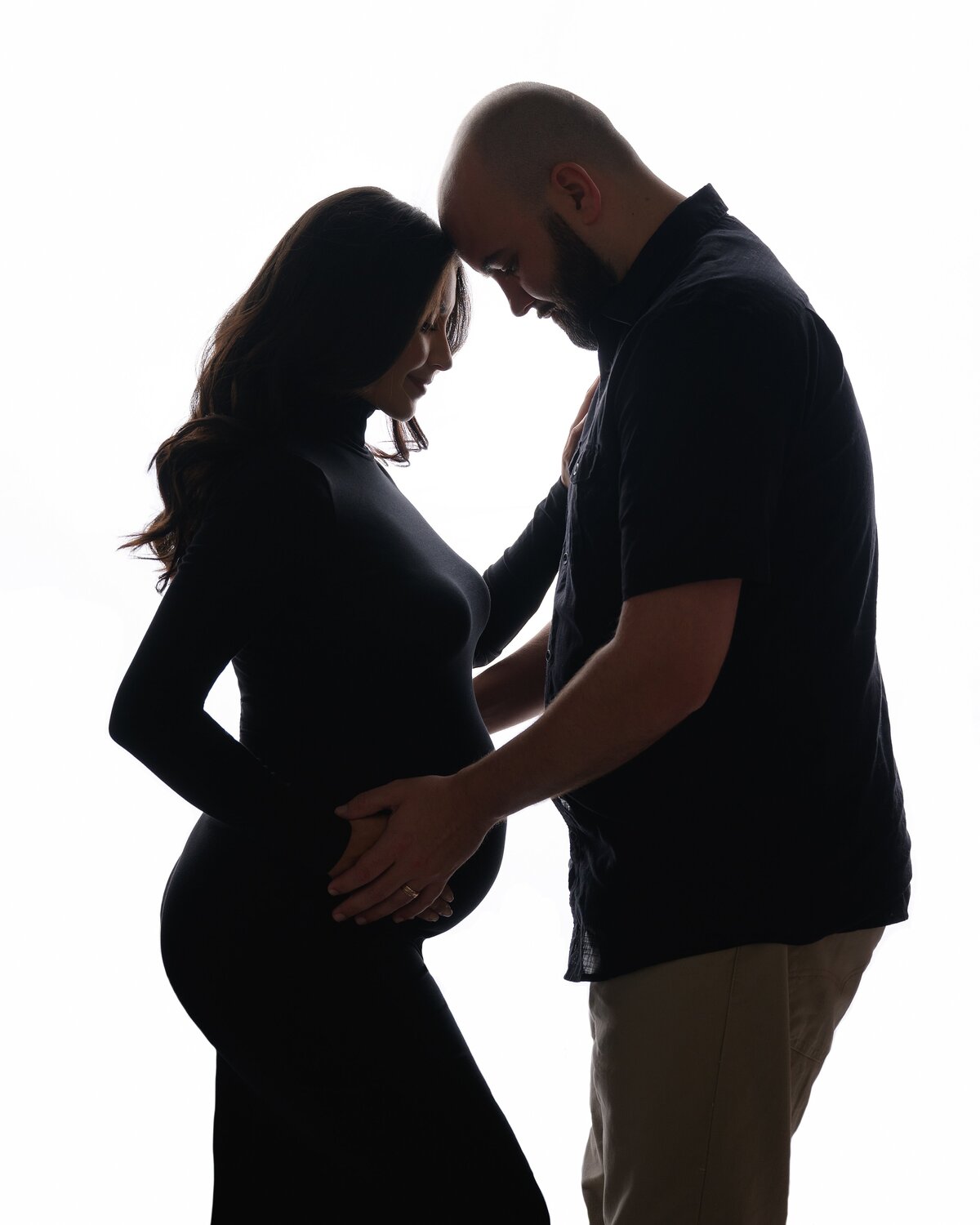 Silhouette maternity photoshoot in a South Florida studio