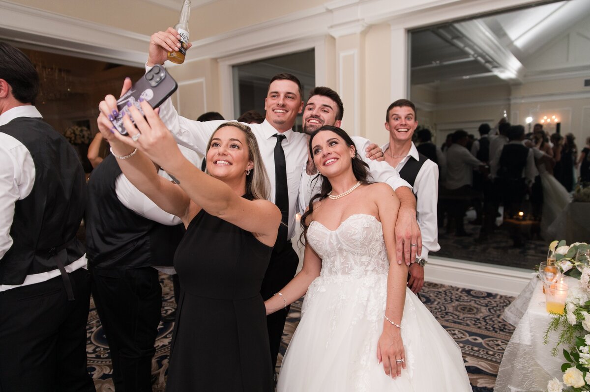 group taking selfie on wedding day