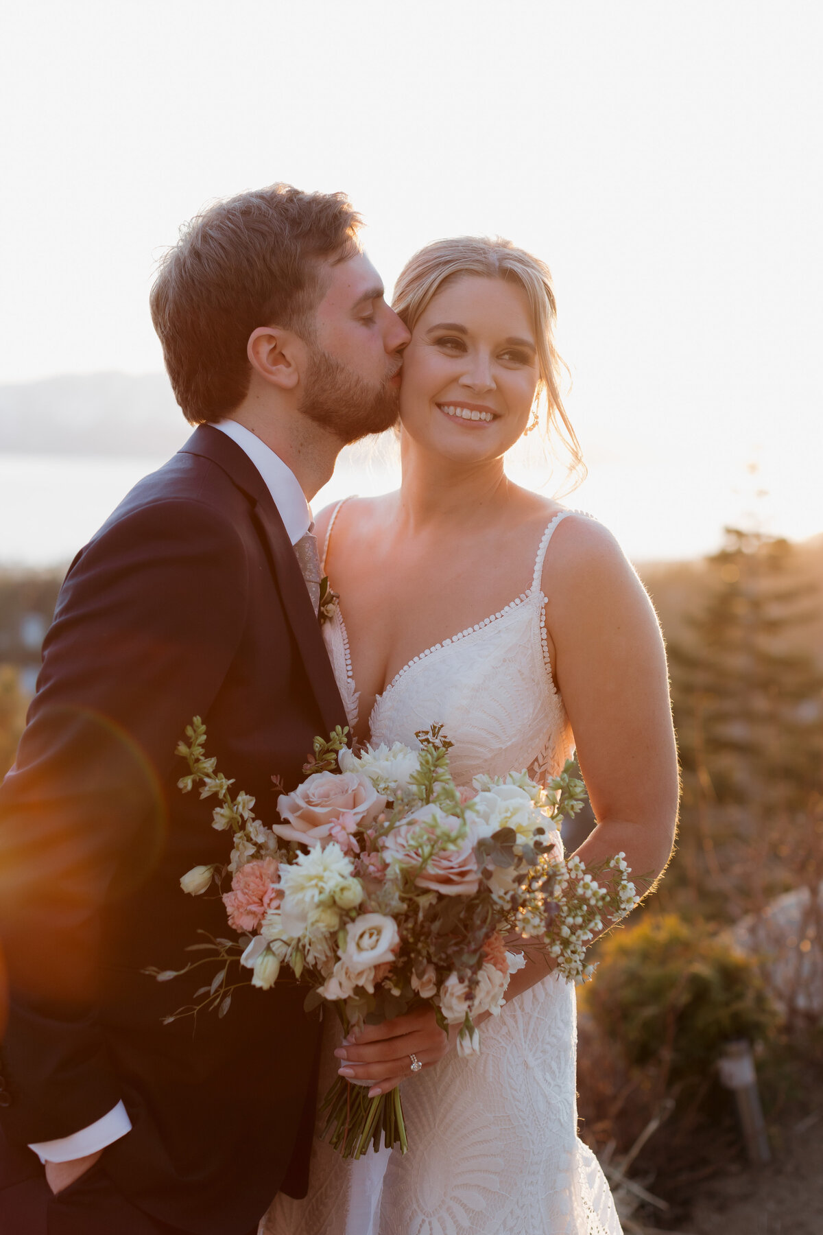 Bride preparing for her South Lake Tahoe wedding at Tahoe Blue Estate, with a view of the snow-capped mountains.