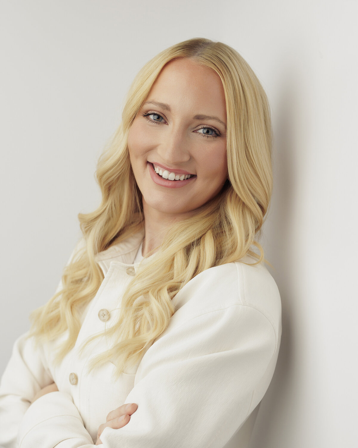 Luxury branding headshot for a female entrepreneur wearing a chic black blazer, photographed by Haili Barton.