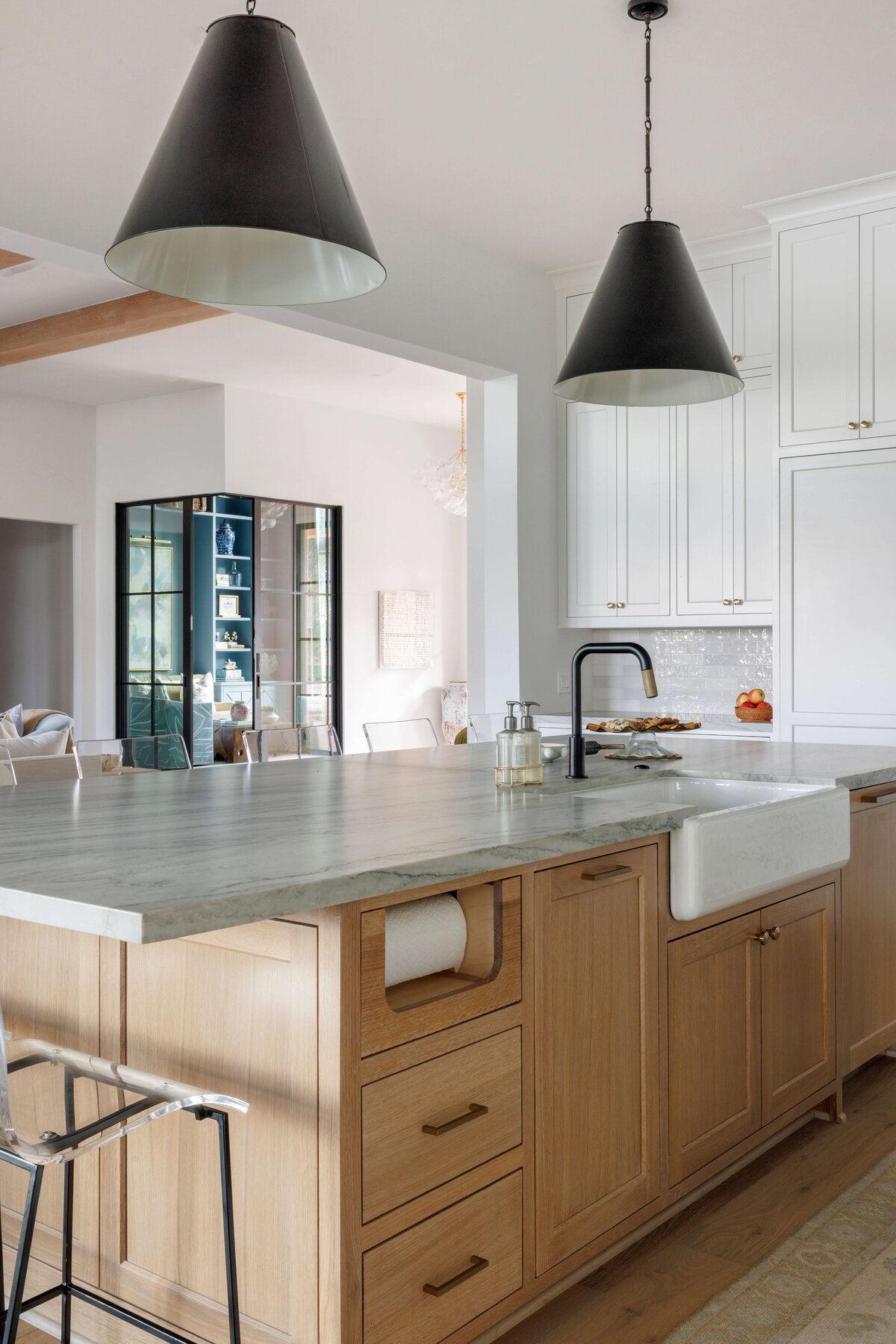 oyster creek studios missouri city new build wooden cabinets with black accent lighting and marble counters in kitchen