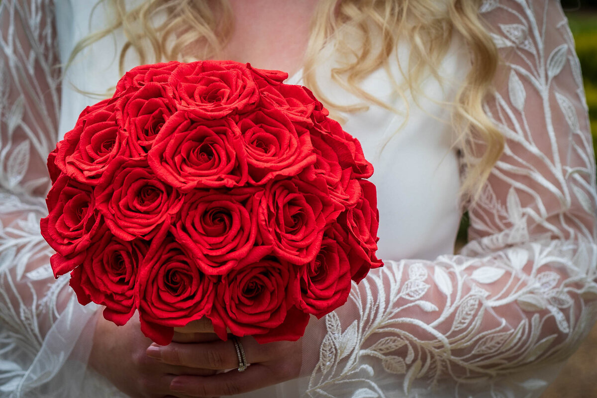 Paper wedding posy of red roses