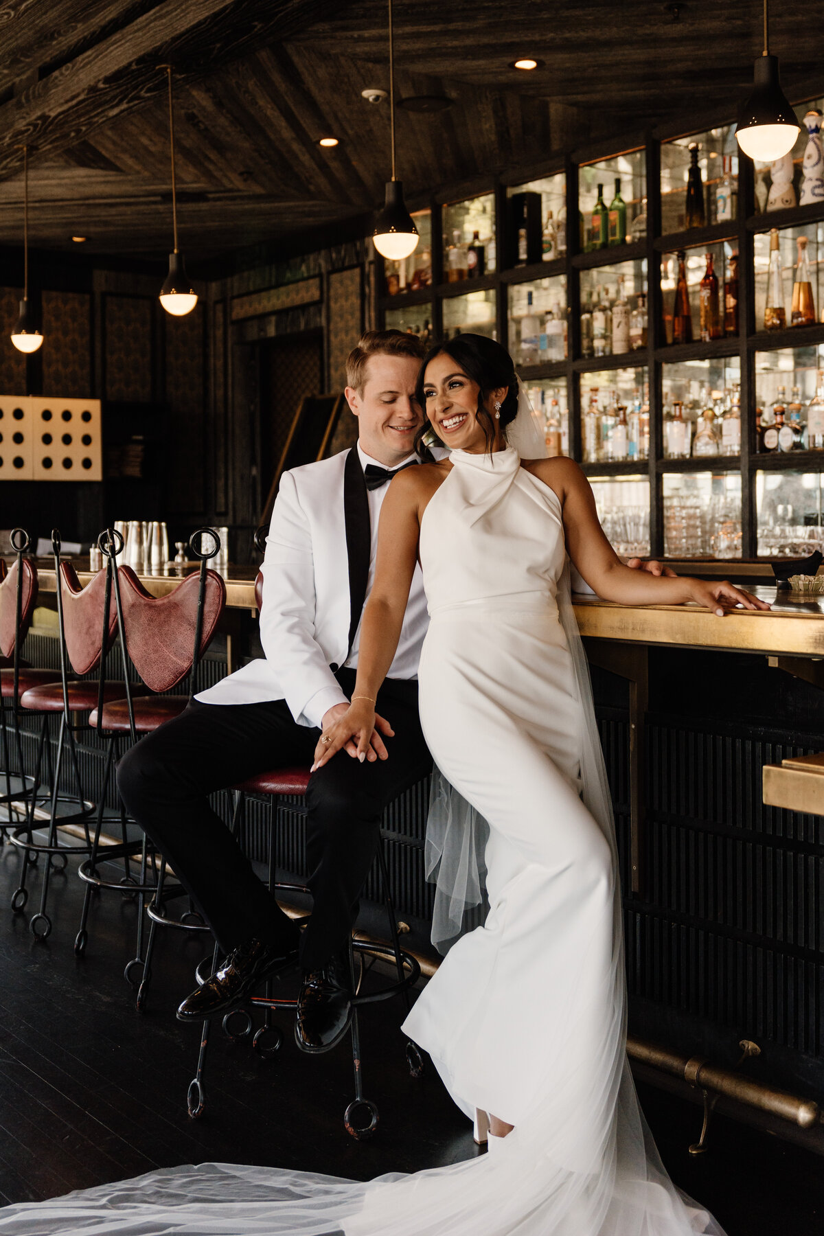 bride and groom in bar on wedding day